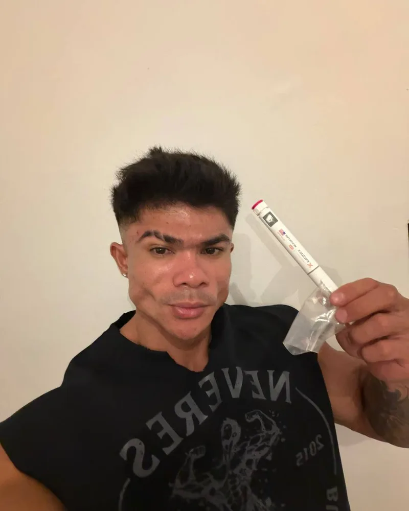 Isai holding an ENCODEX product